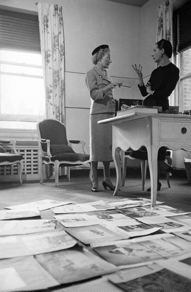 "Editor Carmel Snow and Fashion Editor Diana Vreeland reviewing magazine layouts in HARPER'S BAZAAR office," 1952.